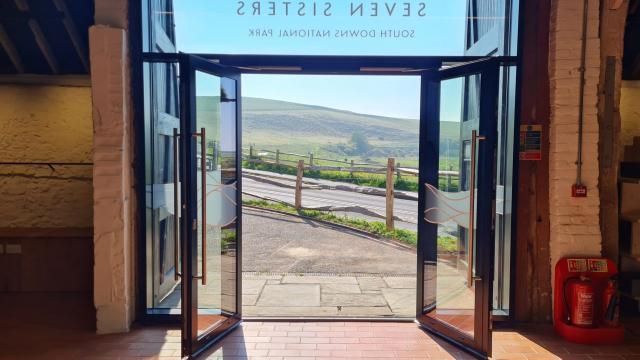 A view towards the Country Park from inside the Visitor Centre with the double doors open