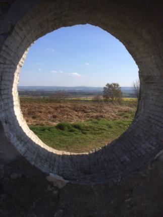 View of open countryside as seen through the centre of the Family Stone feature