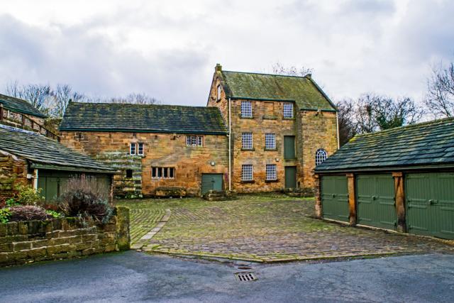 Photograph of exterior of the Mill building showing the old and the new Mill